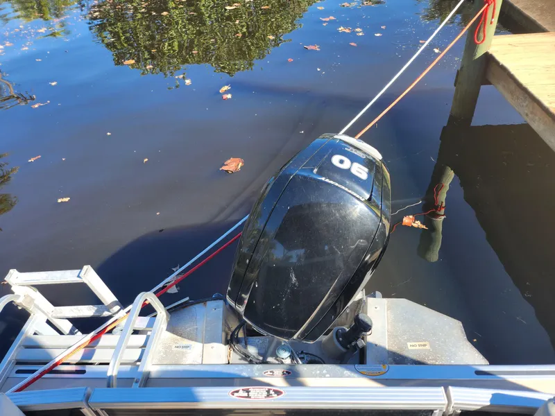 Slide: The Image of Outboard motor of a 2020 Cypress Cay Seabreeze 232 at dock. - 13