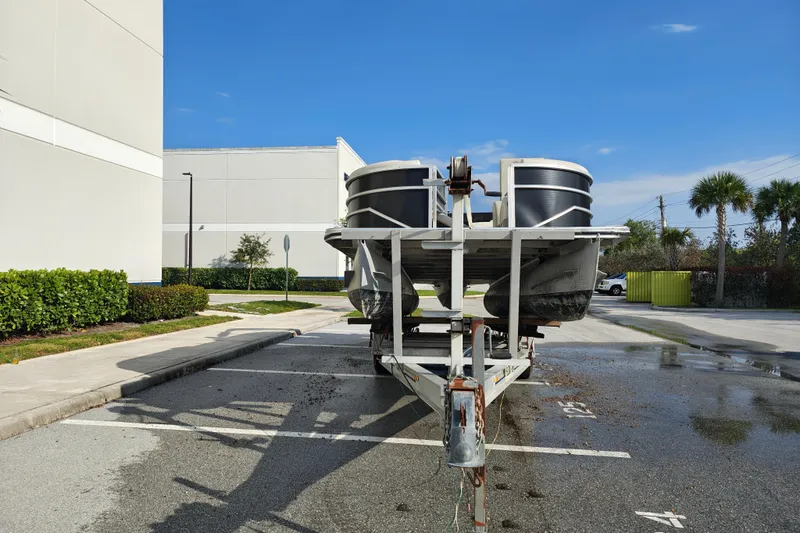 Slide: The Image of 2020 Cypress Cay Seabreeze 232 pontoon boat on trailer in parking lot. - 28