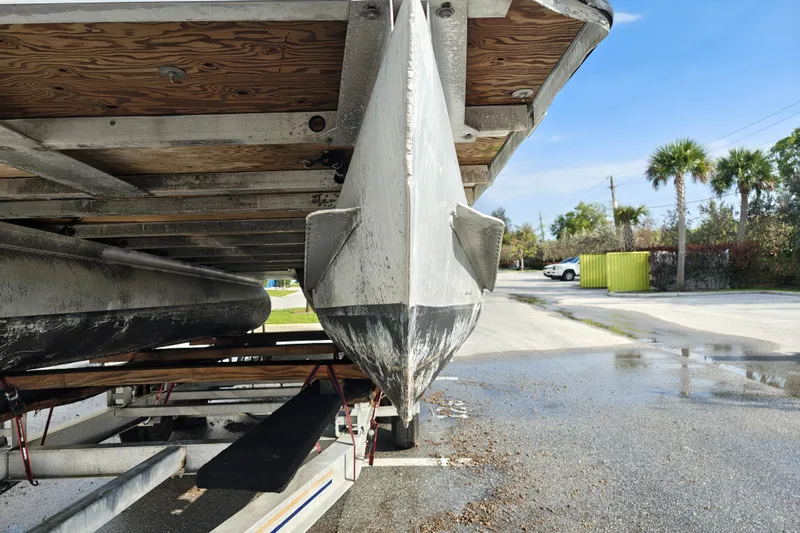 Slide: The Image of Underneath view of a 2020 Cypress Cay Seabreeze 232 pontoon boat on a trailer. - 32
