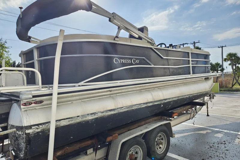 Slide: The Image of 2020 Cypress Cay Seabreeze 232 pontoon boat on a trailer in a parking lot. - 34