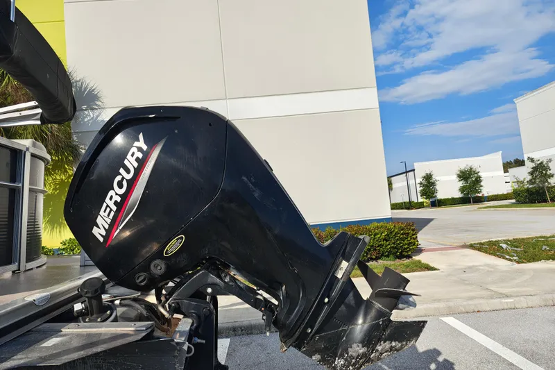 Slide: The Image of Mercury outboard motor on a 2020 Cypress Cay Seabreeze 232 boat, parked outdoors. - 36