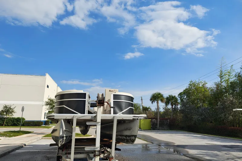 Slide: The Image of 2020 Cypress Cay Seabreeze 232 pontoon boat on trailer under clear blue sky. - 38