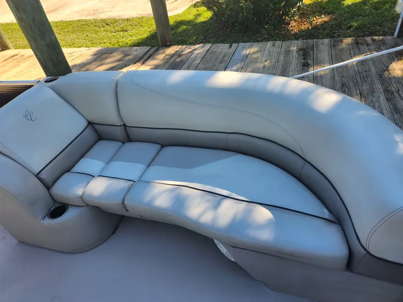 Slide: The Image of Cypress Cay Seabreeze 232, 2020, gray leather seating on a boat. - 9