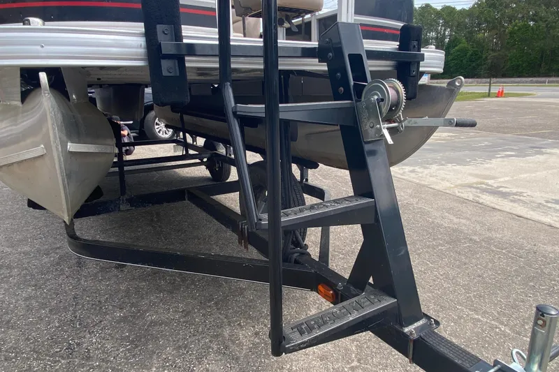 Slide: The Image of 2014 TRACKER MARINE SUN TRACKER 18 DLX pontoon boat on trailer, close-up view. - 11