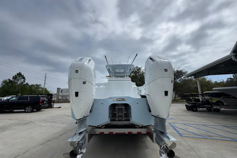 Slide: The Image of 2026 Invincible 33 Catamaran with dual outboard engines on a trailer. - 14
