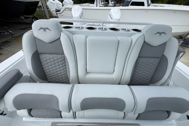 Slide: The Image of Luxurious seating on 2026 Invincible 33 Catamaran, featuring gray and white upholstery. - 28