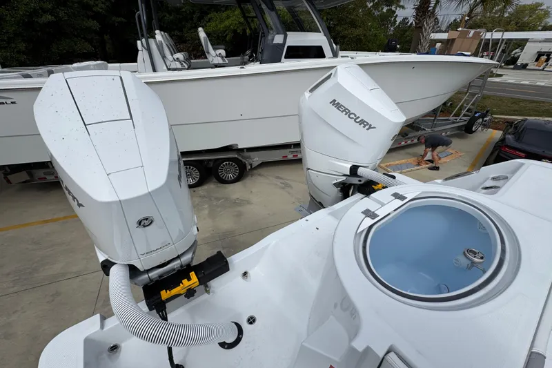 Slide: The Image of 2026 Invincible 33 Catamaran with Mercury engines on trailer, viewed from above. - 42