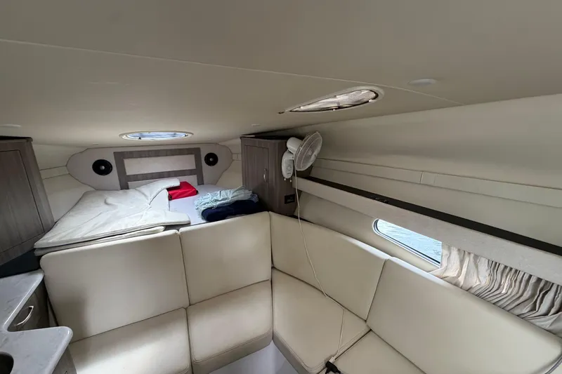 Slide: The Image of Interior of 2022 Regal 33 XO yacht with cozy seating and sleeping area. - 20