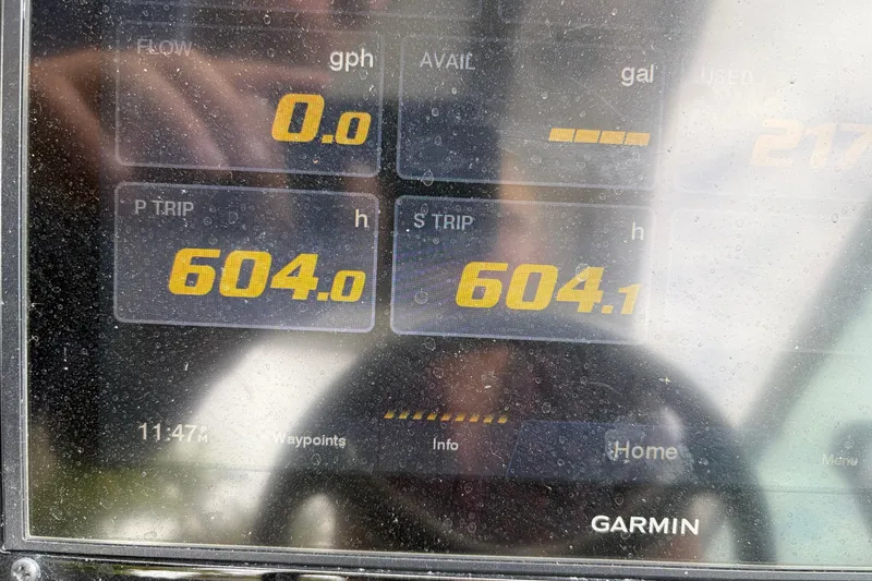 Slide: The Image of Garmin display on 2022 Regal 33 XO showing trip data and fuel flow. - 22