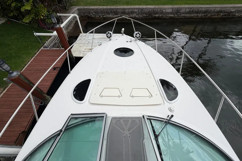 Slide: The Image of 2022 Regal 33 XO boat docked, top view showing deck and water surroundings. - 3