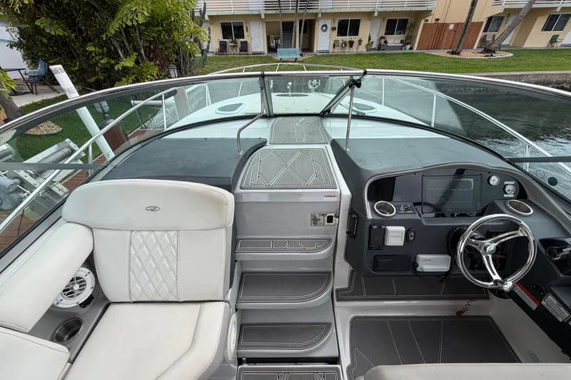Slide: The Image of 2022 Regal 33 XO boat cockpit with modern dashboard and seating. - 8