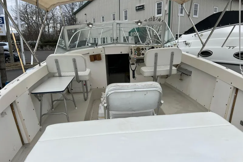 Slide: The Image of 1970 Bertram 25 Moppie boat interior with seating and steering wheel. - 16