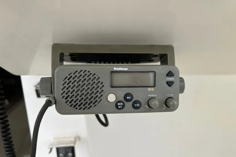 Slide: The Image of Raytheon marine radio on 1970 Bertram 25 Moppie boat, featuring channel controls. - 21