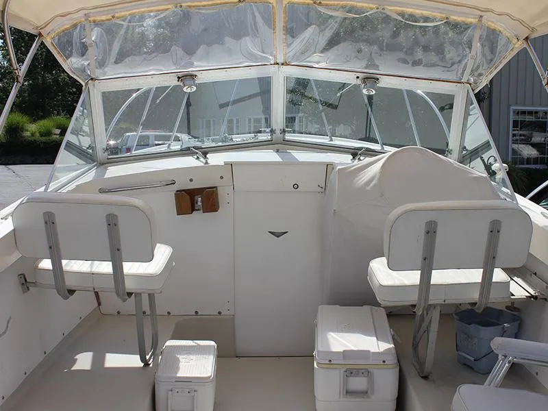 Slide: The Image of Interior of a 1970 Bertram 25 Moppie boat with white seating. - 3