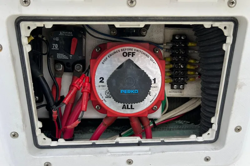 Slide: The Image of Electrical panel of a 1970 Bertram 25 Moppie boat with Perko switch and wiring. - 44