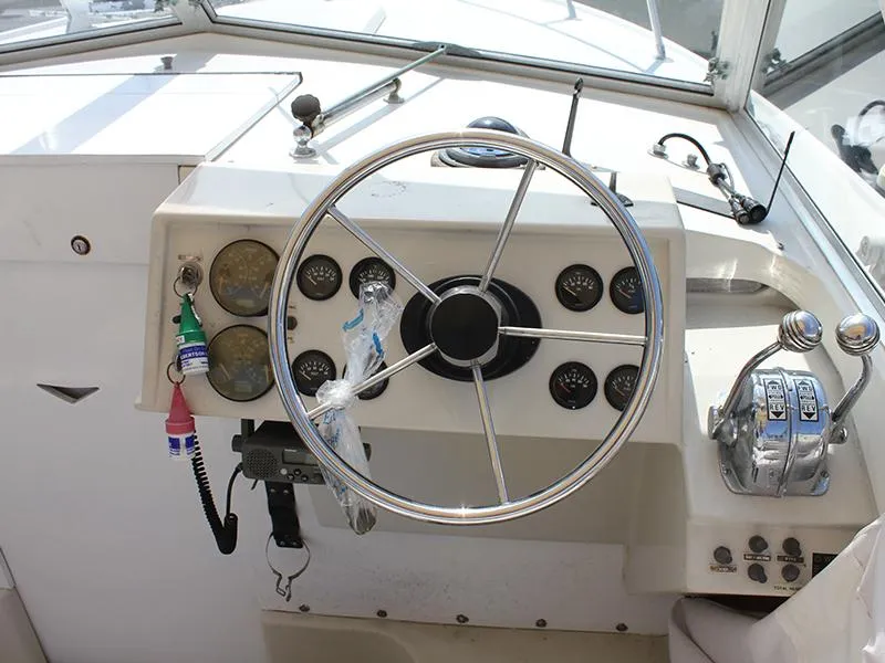 Slide: The Image of Helm of a 1970 Bertram 25 Moppie boat with instruments. - 6