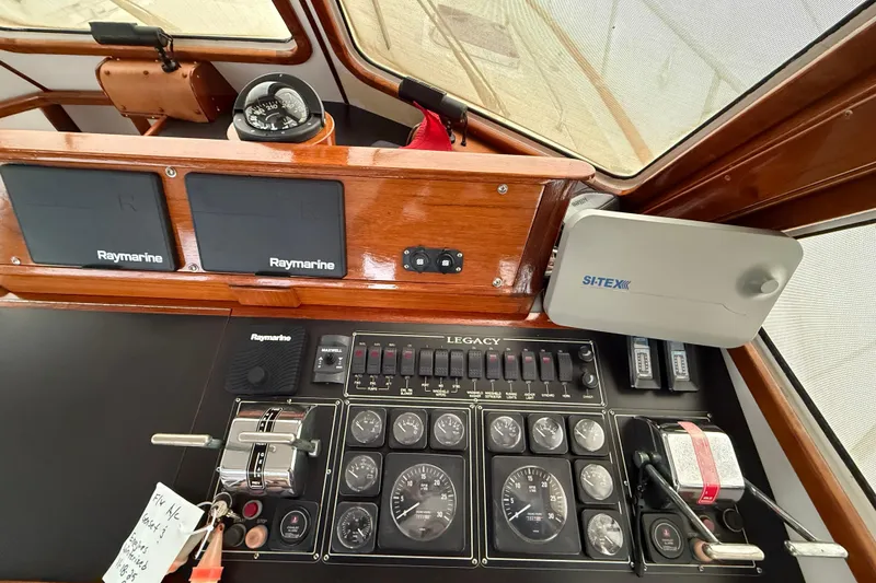 Slide: The Image of Control panel of a 1996 Legacy Yachts 40 with navigation instruments. - 9