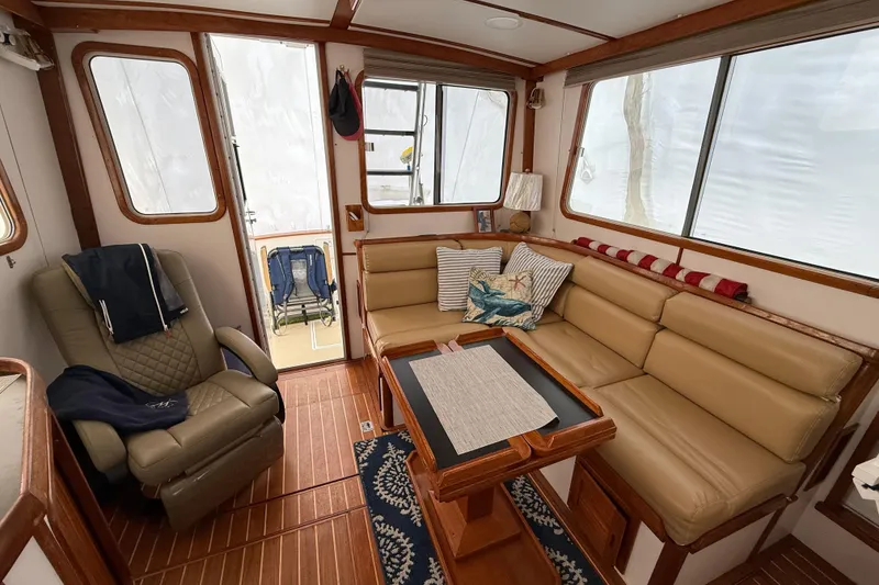 Slide: The Image of Cozy interior of 1996 Legacy Yachts 40 with leather seating and nautical decor. - 5