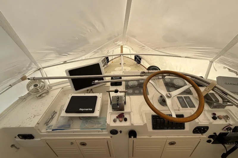 Slide: The Image of Helm of 1996 Legacy Yachts 40 with navigation equipment and wooden steering wheel. - 27
