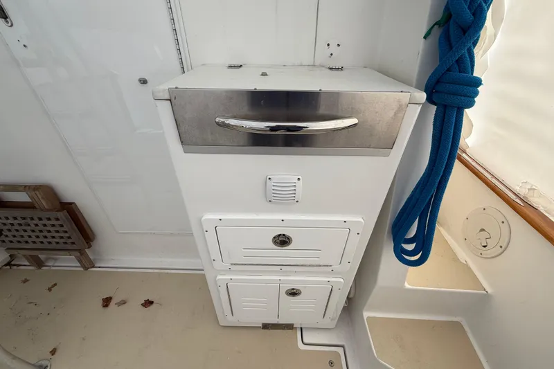 Slide: The Image of Legacy Yachts 40 (1996) interior with storage compartments and blue rope. - 22