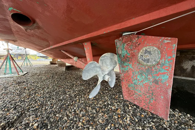 Slide: The Image of Underwater view of 1996 Legacy Yachts 40 propeller and rudder on gravel. - 33