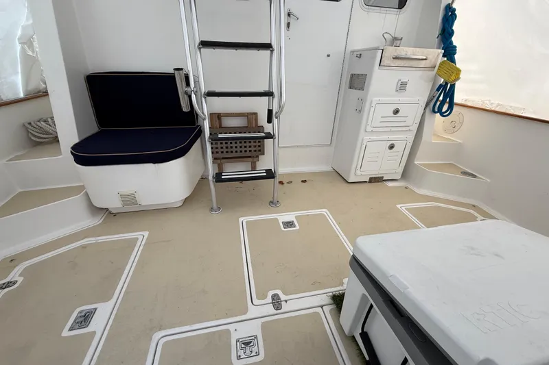 Slide: The Image of Interior of a 1996 Legacy Yachts 40, featuring seating and storage compartments. - 21