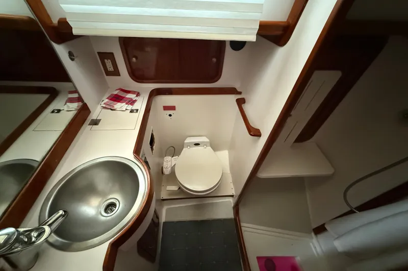 Slide: The Image of Bathroom interior of 1996 Legacy Yachts 40, featuring sink and toilet. - 18