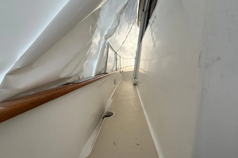 Slide: The Image of Narrow deck passage on a 1996 Legacy Yachts 40, covered with protective material. - 24