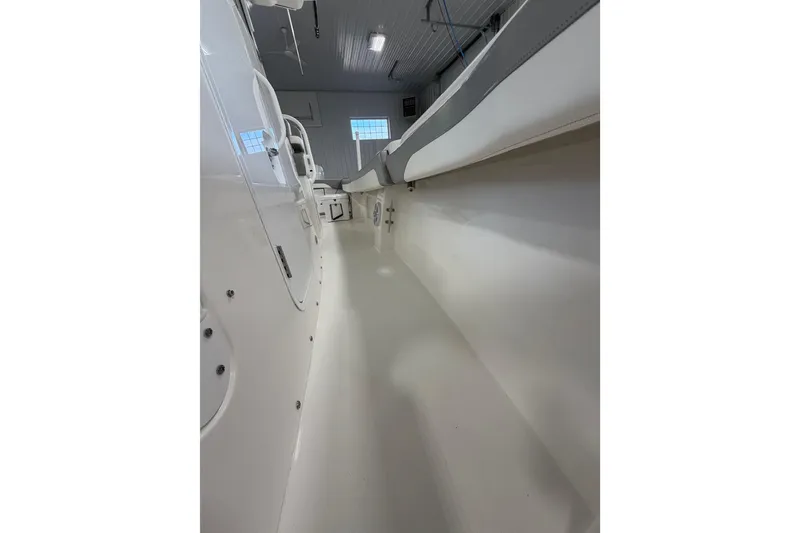 Slide: The Image of 2023 Regulator 31 boat interior, showcasing sleek white design and spacious layout. - 20