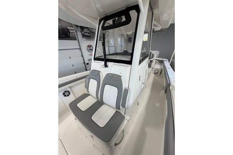 Slide: The Image of 2023 Regulator 31 boat interior with cushioned seating and modern design. - 21