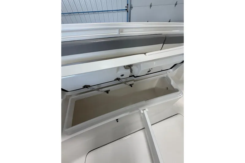 Slide: The Image of Open storage compartment on a 2023 Regulator 31 boat, showcasing interior details. - 26