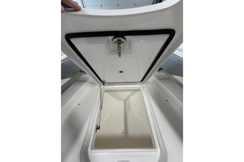Slide: The Image of Open storage compartment on 2023 Regulator 31 boat, showcasing interior space. - 29