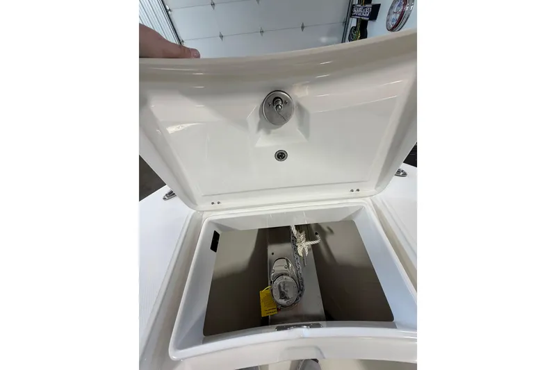 Slide: The Image of Open storage compartment on 2023 Regulator 31 boat, showcasing interior details. - 30