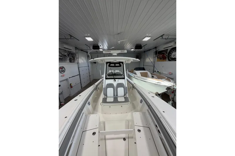 Slide: The Image of 2023 Regulator 31 boat in a garage, showcasing sleek design and spacious interior. - 31