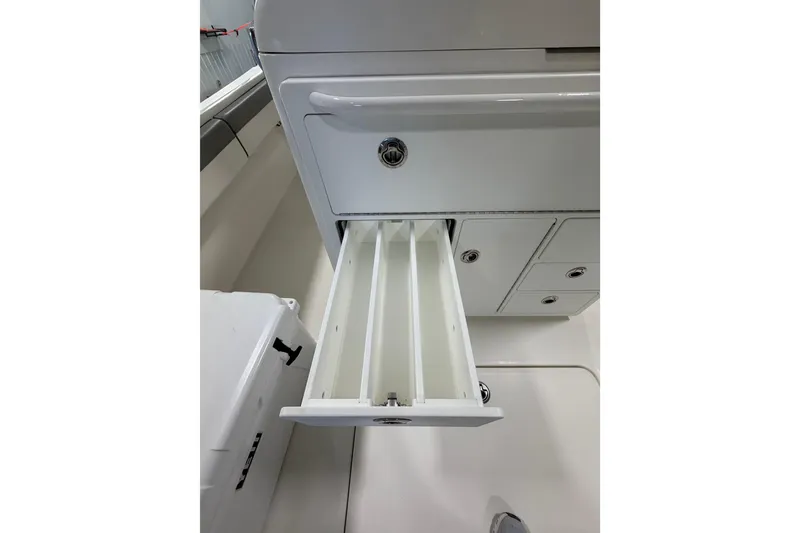 Slide: The Image of 2023 Regulator 31 boat interior with open storage drawer and compartments. - 7