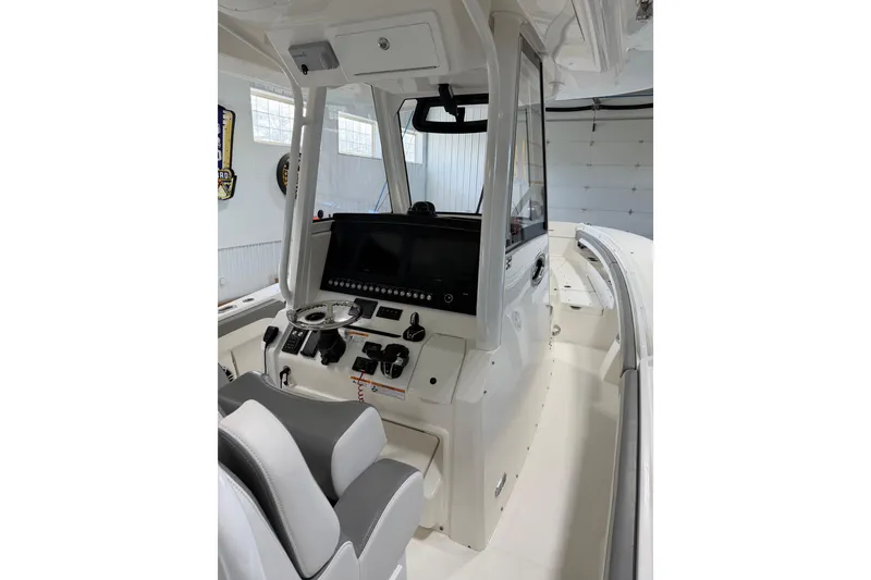 Slide: The Image of 2023 Regulator 31 boat interior with modern helm and seating. - 9