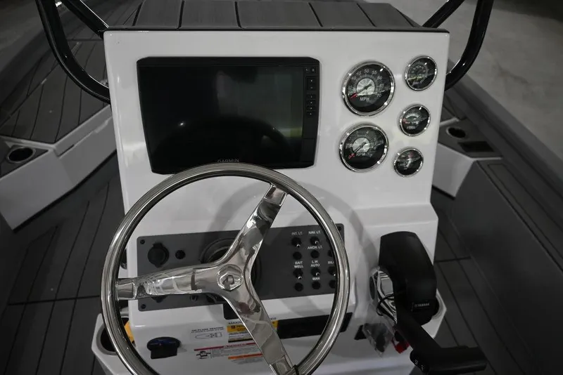 Slide: The Image of Steering console of 2026 Vexus ACX 2210 boat with gauges and controls. - 13