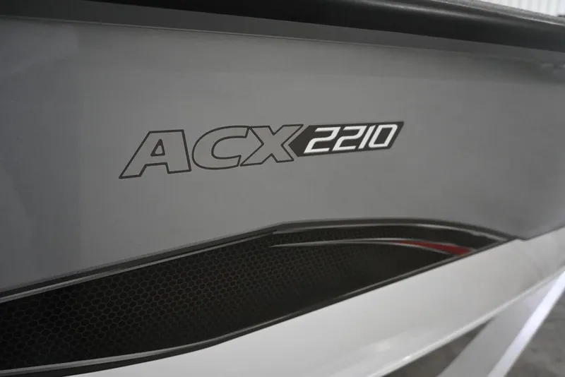 Slide: The Image of 2026 Vexus ACX 2210 boat model logo on sleek gray surface. - 4