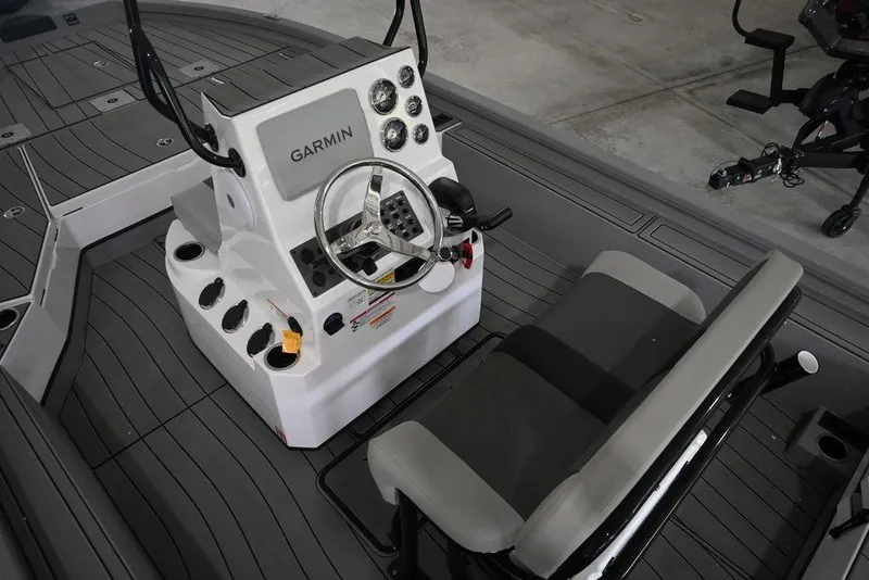 Slide: The Image of 2026 Vexus ACX 2210 boat cockpit with Garmin navigation system and seating. - 6