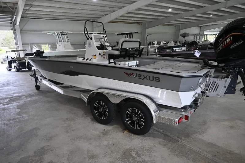 Slide: The Image of 2026 Vexus ACX 2210 boat in showroom, featuring sleek design and modern equipment. - 7