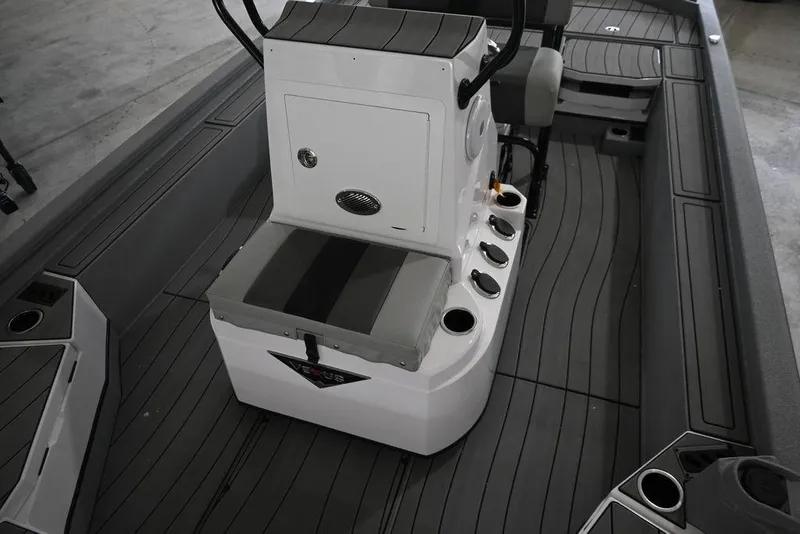 Slide: The Image of 2026 Vexus ACX 2210 boat interior with center console and seating. - 9