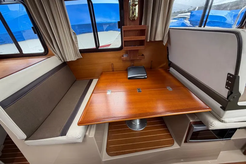 Slide: The Image of Microwave in 2014 Ranger Tugs R-27 boat interior with wooden flooring. - 25