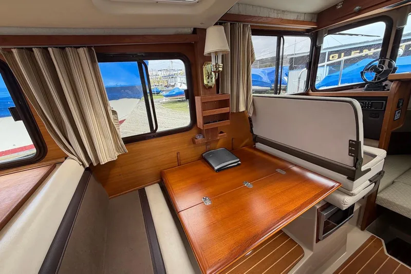 Slide: The Image of Compact kitchen in 2014 Ranger Tugs R-27 with dual-burner stove and sink. - 30