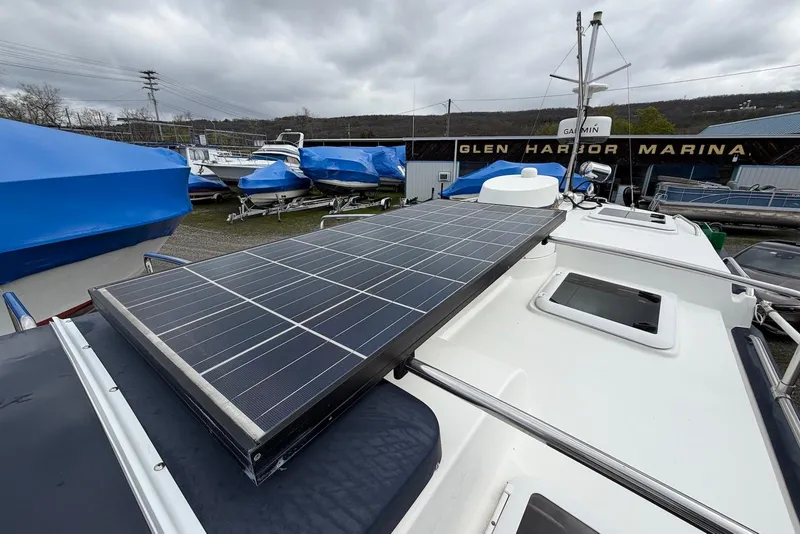 Slide: The Image of Electrical panel of a 2014 Ranger Tugs R-27 boat, featuring various circuit breakers. - 42
