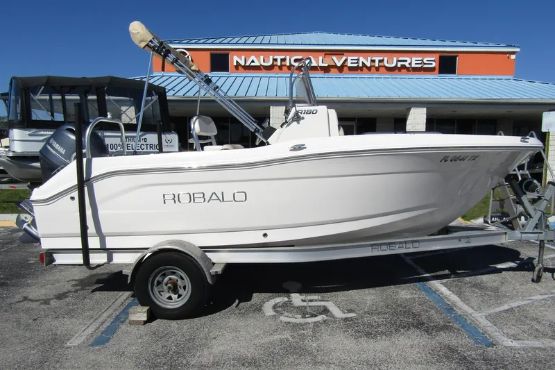 The Image of 2019 Robalo R180 Center Console boat on trailer at Nautical Ventures dealership. - 0