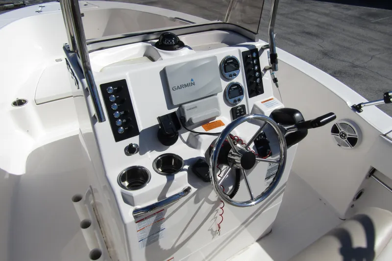 Slide: The Image of 2019 Robalo R180 Center Console boat dashboard with Garmin navigation system. - 11