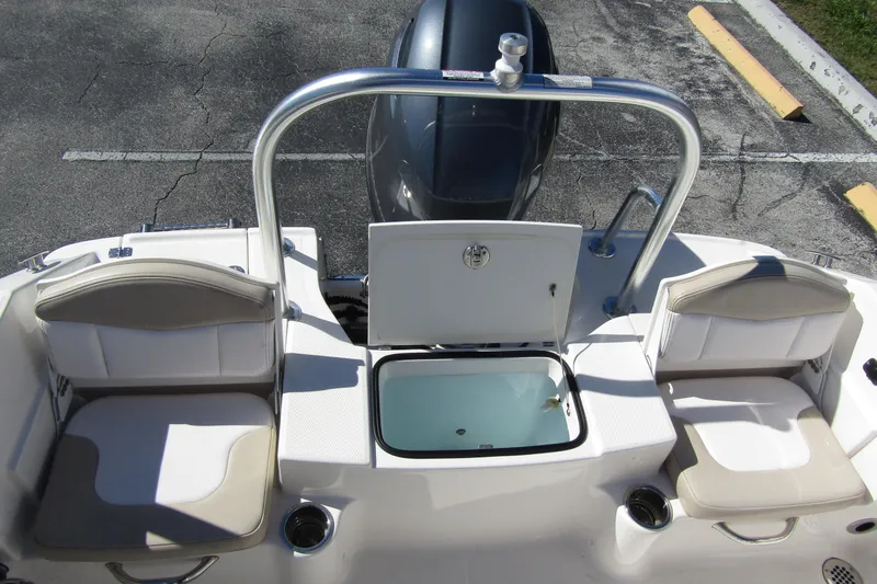 Slide: The Image of 2019 Robalo R180 Center Console boat interior with seating and storage compartments. - 15