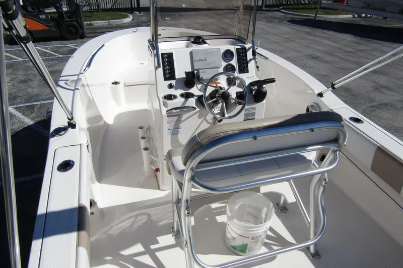 Slide: The Image of 2019 Robalo R180 Center Console boat interior with steering wheel and seating. - 16