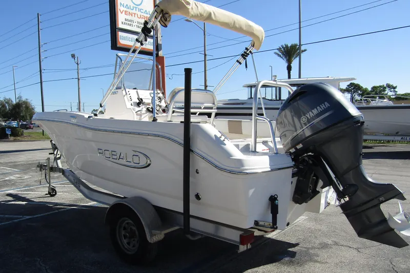 Slide: The Image of 2019 Robalo R180 Center Console boat with Yamaha outboard motor on trailer. - 4
