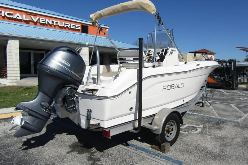 Slide: The Image of 2019 Robalo R180 Center Console boat with Yamaha engine on trailer. - 6